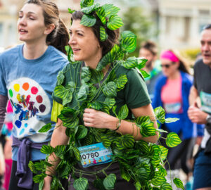 a person in a vine plant costume participates in the annual bay to breakers race