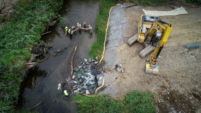 Crews with the Yurok Tribe Construction Corporation and Yurok Tribal Fisheries Program work with California Trout to restore a 1,000-foot section of Prairie Creek for salmon-rearing habitat.